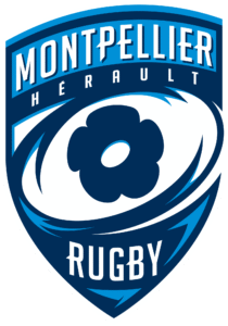 Logo en forme de bouclier du Montpellier Hérault Rugby en bleu et blanc, représentant un ballon de rugby stylisé avec une fleur au centre et le nom du club au-dessus et au-dessous du ballon.
