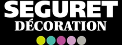 Logo avec les mots Seguret Décoration en caractères gras blancs sur fond noir, au-dessus de cinq cercles de couleur : jaune, vert, bleu, rose et gris.